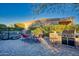 Backyard oasis with hot tub, built-in grill, and patio seating at 18059 W Tierra Del Sol Dr, Surprise, AZ 85387