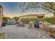 Backyard with hot tub, built-in grill, and patio seating at 18059 W Tierra Del Sol Dr, Surprise, AZ 85387