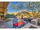 Backyard with fire pit, seating, and outdoor kitchen at 18059 W Tierra Del Sol Dr, Surprise, AZ 85387