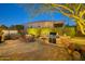 Outdoor kitchen, fire pit, and hot tub perfect for entertaining at 18059 W Tierra Del Sol Dr, Surprise, AZ 85387