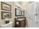 Clean bathroom with marble countertop and dark wood cabinets at 18059 W Tierra Del Sol Dr, Surprise, AZ 85387