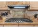 Kitchen cooktop with modern gas burners and sleek design at 18059 W Tierra Del Sol Dr, Surprise, AZ 85387
