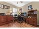 Home office with L-shaped desk and multiple monitors at 18059 W Tierra Del Sol Dr, Surprise, AZ 85387