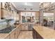Gourmet kitchen features granite countertops, custom cabinetry, and high-end appliances at 18059 W Tierra Del Sol Dr, Surprise, AZ 85387