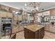 Gourmet kitchen with double ovens, granite island, and open layout at 18059 W Tierra Del Sol Dr, Surprise, AZ 85387