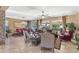 Spacious living area with tile floors, large windows, and comfortable seating at 18059 W Tierra Del Sol Dr, Surprise, AZ 85387