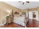 Spacious main bedroom with hardwood floors and en-suite bathroom access at 18059 W Tierra Del Sol Dr, Surprise, AZ 85387