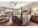Luxurious main bedroom boasts a king-size bed and ample natural light at 18059 W Tierra Del Sol Dr, Surprise, AZ 85387