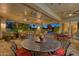 Covered patio with seating area, multiple fans, and pool view at 18059 W Tierra Del Sol Dr, Surprise, AZ 85387