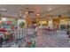 Large covered patio with seating, dining areas, and views into the home at 18059 W Tierra Del Sol Dr, Surprise, AZ 85387
