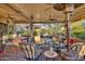 Outdoor patio with comfortable seating and fire pit areas at 18059 W Tierra Del Sol Dr, Surprise, AZ 85387