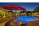 Night view of a relaxing kidney-shaped pool at 18059 W Tierra Del Sol Dr, Surprise, AZ 85387