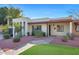 Single story home with landscaped yard and walkway at 1821 W Claremont St, Phoenix, AZ 85015