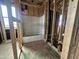 An under-construction bathroom with the bath tub and pipes ready at 22820 E Lords Way, Queen Creek, AZ 85142