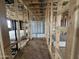 Bathroom in construction featuring wooden framing, a shower tub, and open layout for customization at 22820 E Lords Way, Queen Creek, AZ 85142