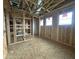 Partially framed bedroom showcasing window placements, wooden framing, and open layout for customization at 22820 E Lords Way, Queen Creek, AZ 85142