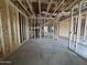 Spacious interior view of home under construction with exposed framing, ductwork, and staircase showcasing potential at 22820 E Lords Way, Queen Creek, AZ 85142