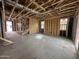 Spacious interior view of home under construction with exposed framing, ductwork, and staircase showcasing potential at 22820 E Lords Way, Queen Creek, AZ 85142