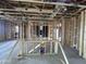 Spacious interior view of home under construction with exposed framing and ductwork showcasing potential at 22820 E Lords Way, Queen Creek, AZ 85142