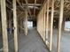 Spacious interior view of home under construction with exposed framing and open layout showcasing potential at 22820 E Lords Way, Queen Creek, AZ 85142