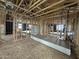 Spacious room featuring modern construction with exposed beams and plywood flooring at 22820 E Lords Way, Queen Creek, AZ 85142