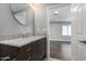 Clean bathroom with a marble vanity and view of a bedroom at 2622 E Indianola Ave, Phoenix, AZ 85016