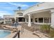 Expansive backyard with a pool, outdoor kitchen, manicured lawn, and plenty of room for recreation at 321 N Portland Ave, Gilbert, AZ 85234