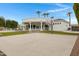 Spacious backyard basketball court area with a lovely view of the house architecture and trimmed trees at 321 N Portland Ave, Gilbert, AZ 85234