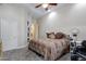 Inviting bedroom with a ceiling fan and a large window at 321 N Portland Ave, Gilbert, AZ 85234