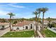 Stunning aerial view of a luxurious home with a meticulously landscaped front yard and mature palm trees at 321 N Portland Ave, Gilbert, AZ 85234