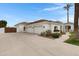 Spacious three-car garage with a long driveway, complementing the home's exterior design at 321 N Portland Ave, Gilbert, AZ 85234