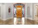 Beautiful foyer with custom front door featuring decorative glass and tile flooring at 321 N Portland Ave, Gilbert, AZ 85234