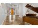 Welcoming foyer features a custom entry door and a view of the living area with piano at 321 N Portland Ave, Gilbert, AZ 85234