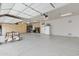 Spacious three-car garage with epoxy floors, built-in cabinets, and ample storage space at 321 N Portland Ave, Gilbert, AZ 85234