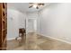 Home office view featuring a writing desk and tiled flooring at 321 N Portland Ave, Gilbert, AZ 85234
