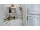 Convenient kitchenette area with granite countertops, tiled backsplash and stainless steel appliances at 321 N Portland Ave, Gilbert, AZ 85234