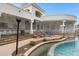 Inviting pool area with swim-up bar, misting system, and ample seating for entertaining guests at 321 N Portland Ave, Gilbert, AZ 85234