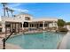 Backyard pool featuring volleyball and basketball, as well as manicured landscaping at 321 N Portland Ave, Gilbert, AZ 85234