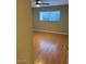 Bright bedroom featuring wood-look floors and large window at 3655 N 5Th Ave # 106, Phoenix, AZ 85013