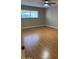 Spacious bedroom with wood-look floors and ceiling fan at 3655 N 5Th Ave # 106, Phoenix, AZ 85013