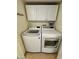 Laundry room with washer, dryer, and overhead cabinets at 3655 N 5Th Ave # 106, Phoenix, AZ 85013