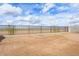 A spacious backyard with an iron fence is ready to design a garden or play area with views of the open landscape at 4312 E Bradford Ave, San Tan Valley, AZ 85143