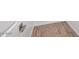 A bathroom floor features wood-look tiling at 4312 E Bradford Ave, San Tan Valley, AZ 85143