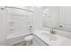 Bright bathroom with white vanity, sink, toilet, and shower-tub combination at 4312 E Bradford Ave, San Tan Valley, AZ 85143