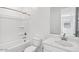 A bright bathroom features a shower-tub combo and a vanity at 4312 E Bradford Ave, San Tan Valley, AZ 85143
