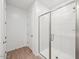A bright bathroom features a glass-enclosed shower, and a door to the side at 4312 E Bradford Ave, San Tan Valley, AZ 85143