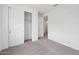 Bedroom featuring neutral carpet, closet and door, and ample natural light at 4312 E Bradford Ave, San Tan Valley, AZ 85143