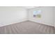 Bright bedroom with neutral carpet, bright window, and ample natural light at 4312 E Bradford Ave, San Tan Valley, AZ 85143