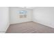 Bright bedroom with neutral carpet, bright window, and ample natural light at 4312 E Bradford Ave, San Tan Valley, AZ 85143