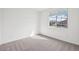 Cozy bedroom with neutral carpet, bright window, and ample natural light at 4312 E Bradford Ave, San Tan Valley, AZ 85143